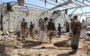Yemenis check the rubble of a building hit in US strikes in the country's northern province of Saada on April 29, 2025. The United Nations expressed deep alarm on April 28, at reports that US strikes on Yemen killed scores of people at a migrant detention centre in a stronghold of the Huthi rebels.  The US military has hammered the Iran-backed Huthis with near-daily strikes since March 15 in an operation dubbed "Rough Rider", seeking to end their attacks on vessels in the Red Sea and Gulf of Aden. (Photo by AFP)