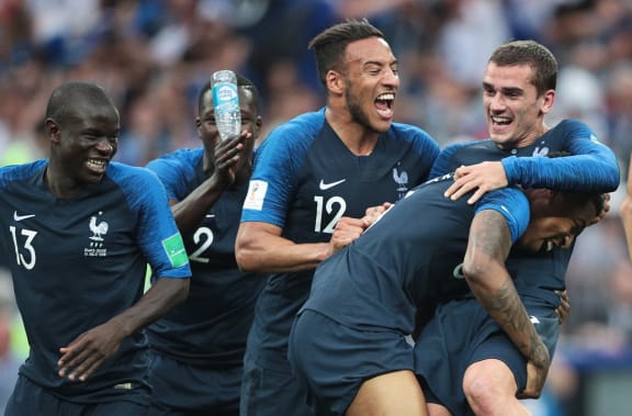 France's players celebrate their team's 4-2 victory in the World Cup final soccer match.