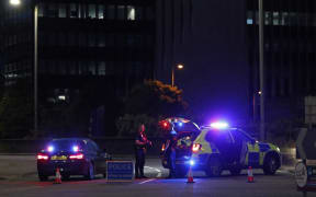 Police secure a cordon near Forbury Gardens park in Reading, west of London, on June 20, 2020 following a stabbing incident.