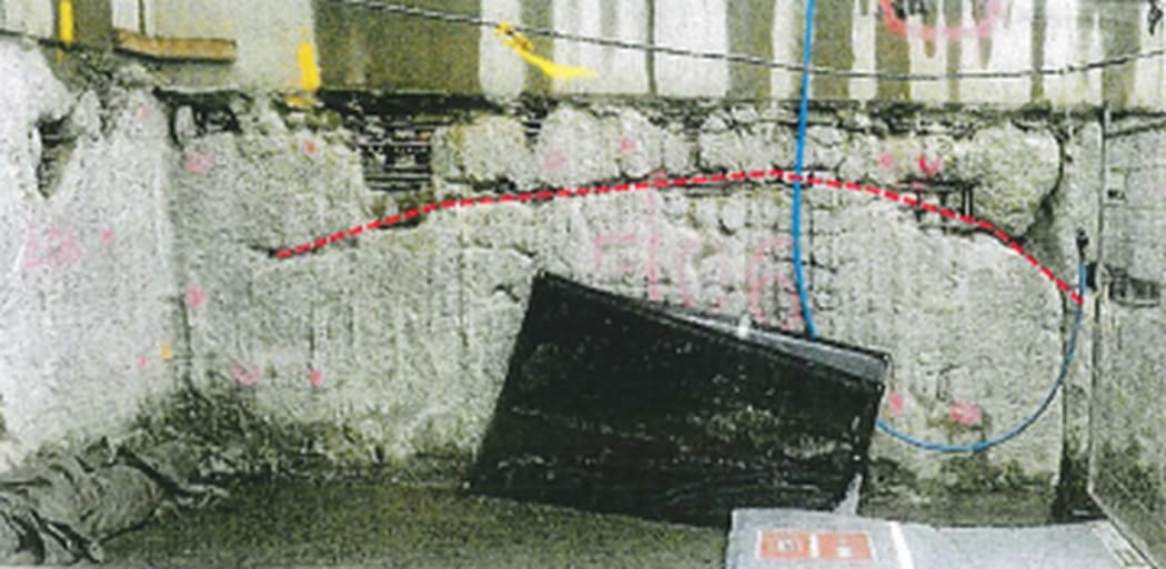 Contamination and lack of concrete cover exposes the steel reinforcing.