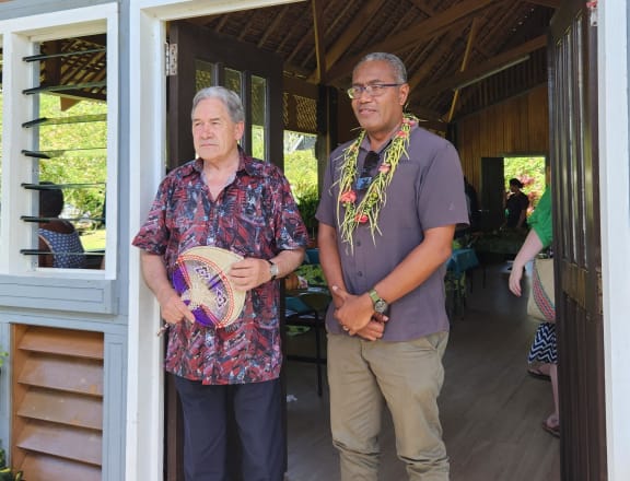 New Zealand Foreign Affairs Minister Winston Peters stands with leader of the Independent Group Peter Kenilorea Jr