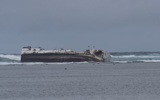 The Seahawk No.68 aground on a reef near Pago Pago.