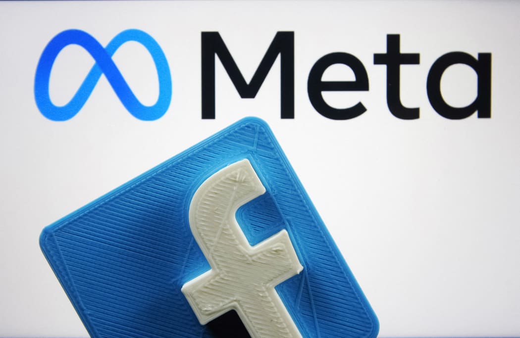 Facebook logo and new company brand Meta Platforms Inc. logo are pictured in this illustrative photo taken in Kyiv on 29 October, 2021.