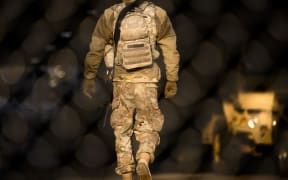 A member of the Minnesota National Guard stand watch outside the Hennepin County Government Center in March 2021