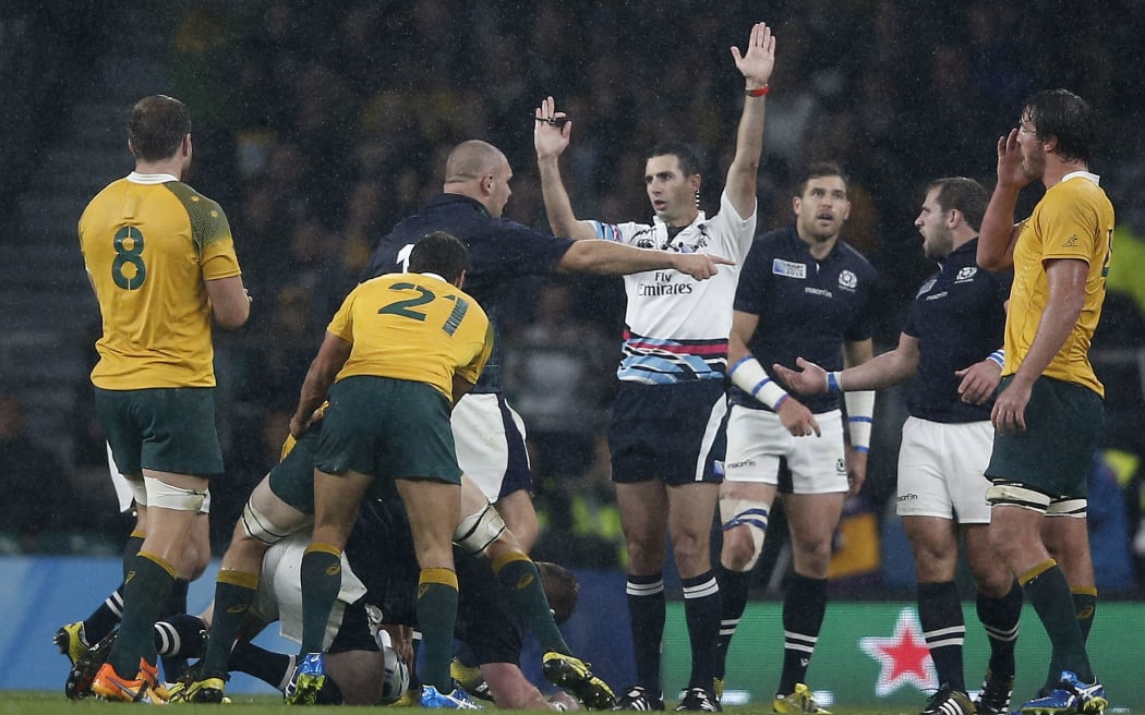 South African referee Craig Joubert (C) awards the final penalty to Australia during a quarter final match of the 2015 Rugby World Cup between Australia and Scotland at Twickenham stadium, southwest London on October 18, 2015. AFP PHOTO / ADRIAN DENNIS