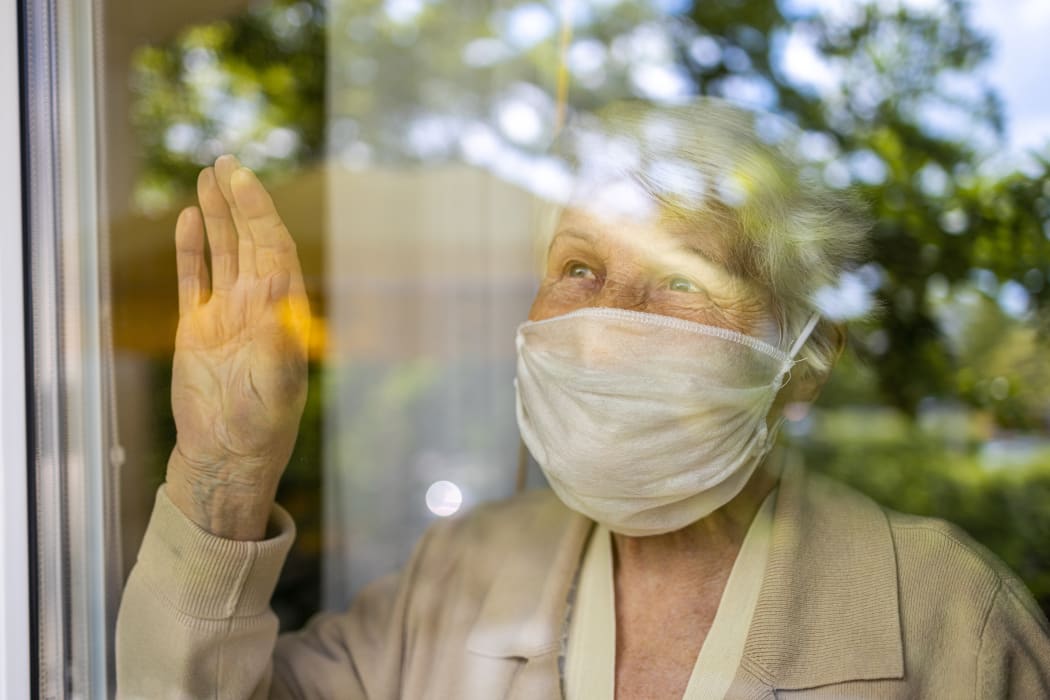 Elderly person in lockdown, isolation, isolate, Covid-19, mask, mental health.