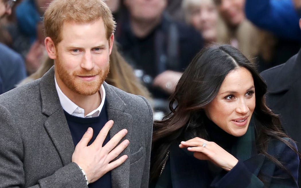 Prince Harry and Meghan Markle arrive at the Esplanade in front of the Edinburgh Castle in Edinburgh, on February 13, 2018, on their first official joint visit to Scotland.