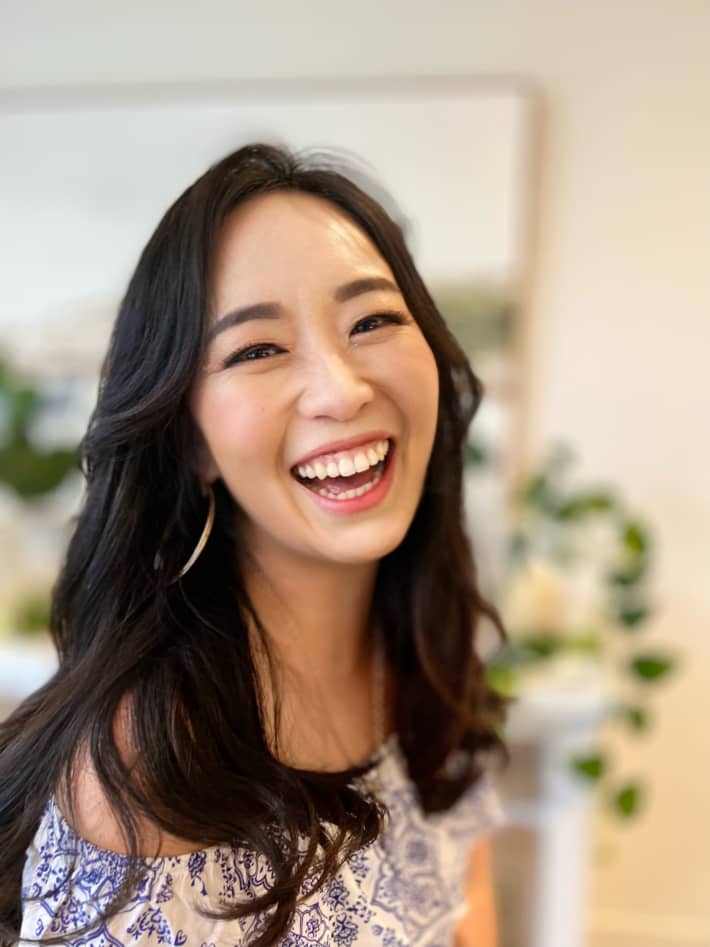 Graci Kim smiles widely at the camera.