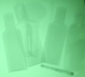 X-ray image of toiletries with hidden scalpel