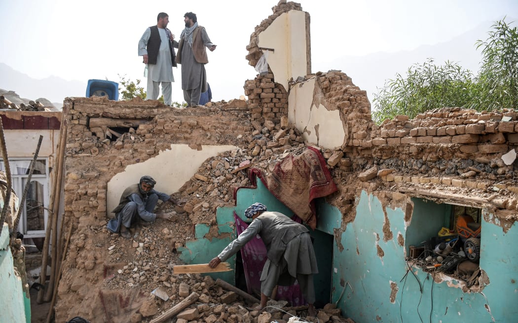 Afghan earthquake survivors search through the remains of a damaged house at a village in Tashqurghan, in the Khulm district of Samangan province on 3 November, 2025. A 6.3-magnitude strong earthquake that struck overnight killed at least 20 people in northern Afghanistan, authorities said, just months after another deadly tremor that left the country reeling.