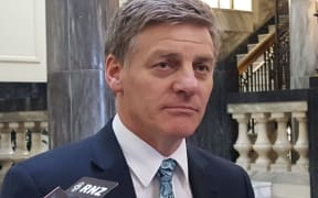 Bill English talks to reporters shortly after Jonathan Coleman pulled out of the leadership race.