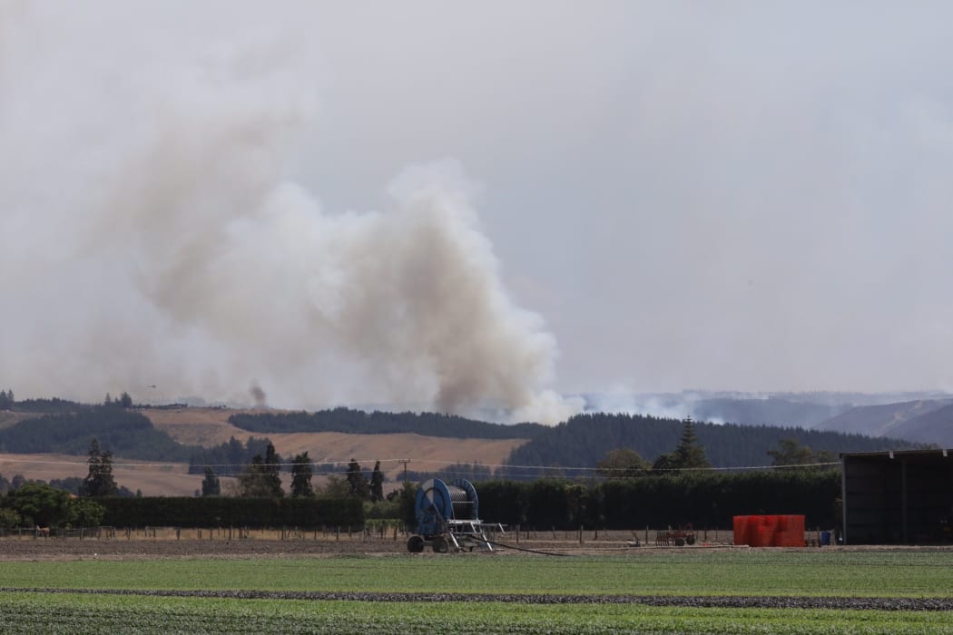 Clouds of smoke are seen rising from the bush fire area at Pigeon Valley this afternoon.