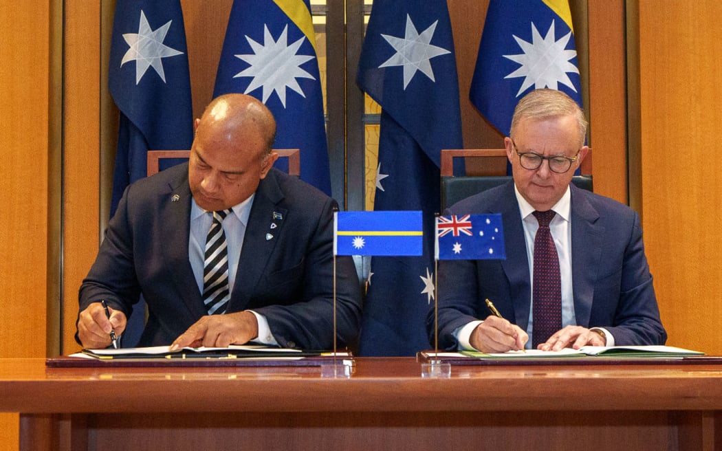 The Nauru-Australia Treaty signed by Nauru's President David Adeang, left, and Australian Prime Minister Anthony Albanese in Canberra. 9 December 2024.
