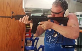 Shane Jones, overseas, firing what has been identified as an AR15 semiautomatic rifle.