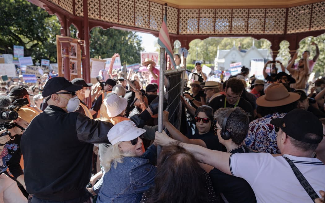 A group of protesters under the rotunda at Albert Park during Posie Parker's rally.