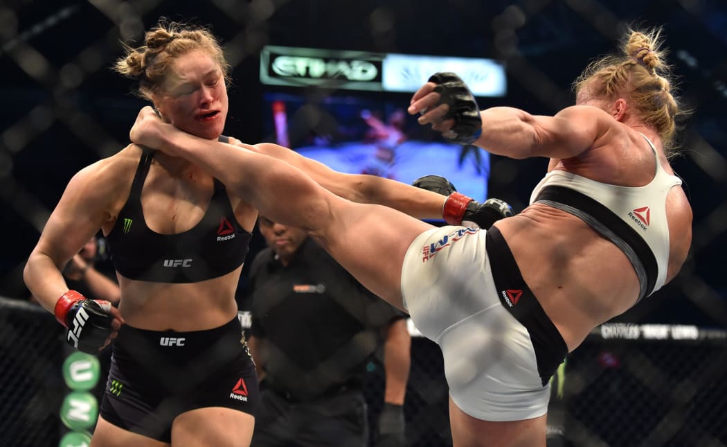 The moment Ronda Rousey (L) was knocked out by Holly Holm (R) at UFC 193 in Melbourne.