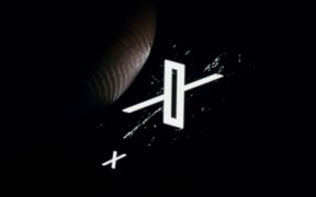 The logo of the microblogging service X (formerly twitter) of the company X Corp is shown on the display of a smartphone.