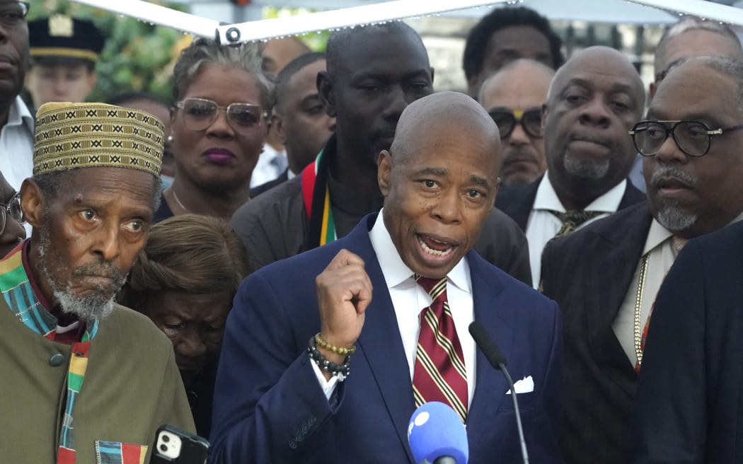 New York City Mayor Eric Adams talks to the press outside Gracie Mansion, the official residence of the mayor of New York City, on September 26, 2024, after he was indicted on federal criminal charges. US federal agents raided the official residence of Mayor Adams early September 26 ahead of the expected announcement of criminal charges against the former city cop once touted as a rising Democratic Party star. The search at the residence known as Gracie Mansion began before dawn, and is the latest shock twist in a graft investigation against the Adams administration. (Photo by TIMOTHY A. CLARY / AFP)