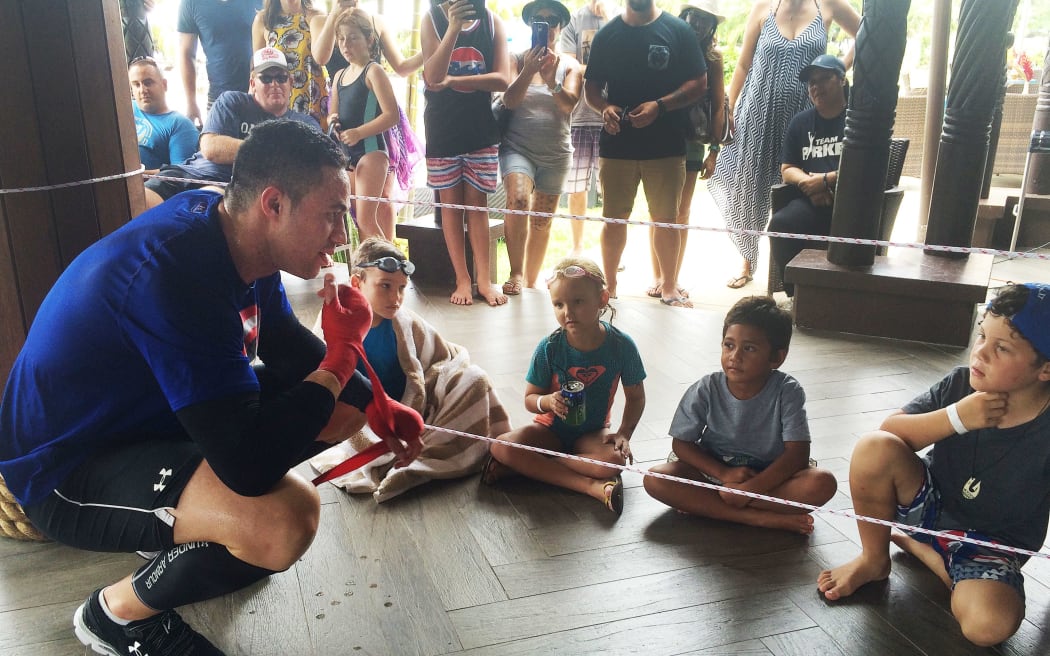Joseph Parker passes on some tips to kids in Apia.