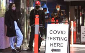 People queue up for Covid-19 testing in Melbourne on May 12, 2021, after a man tested positive to Covid-19 in the first community case in the city for two months.