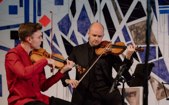 Musicians of the 2024 At The World's Edge Festival on stage.