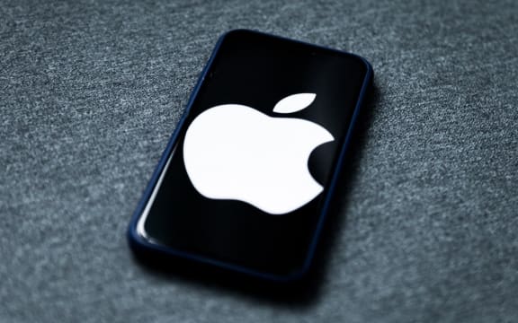 Apple logo displayed on iPhone screen is seen in this illustration photo taken in Poland on February 8, 2021. Facebook reacted negatively to Apple's privacy policy changes.