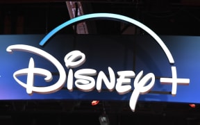 (FILES) In this file photo taken on August 23, 2019 a Disney+ streaming service sign is pictured at the D23 Expo, billed as the "largest Disney fan event in the world," at the Anaheim Convention Center in Anaheim, California.