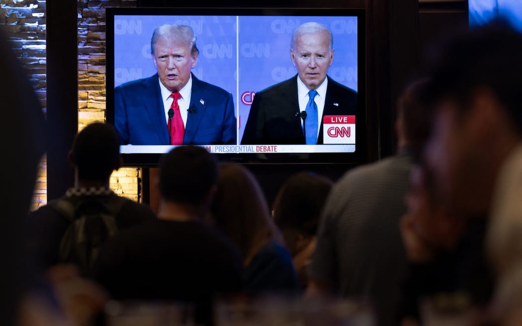 CHICAGO, ILLINOIS - JUNE 27: Guests at the Old Town Pour House watch a debate between President Joe Biden and presumptive Republican nominee former President Donald Trump on June 27, 2024 in Chicago, Illinois. The debate is the first of two scheduled between the two candidates before the November election.   Scott Olson/Getty Images/AFP (Photo by SCOTT OLSON / GETTY IMAGES NORTH AMERICA / Getty Images via AFP)