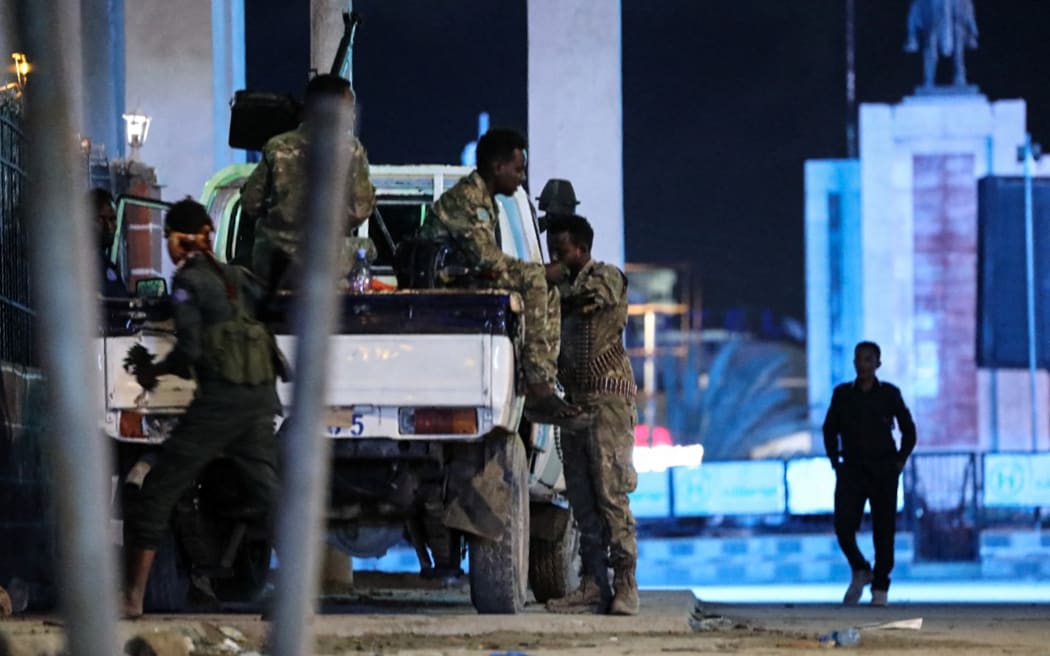 Security forces patrol near the Hayat Hotel after an attack by Al-Shabaab fighters in Mogadishu on 20 August, 2022. - Al-Shabaab fighters attacked a hotel in the Somali capital Mogadishu in a hail of gunfire and explosions on August 19, 2022, with casualties reported, security sources and witnesses said. The assault on the Hayat Hotel triggered a fierce gunfight between security forces and gunmen from the jihadist group who are still holed up inside the building, security official Abdukadir Hassan told AFP. (Photo by Hassan Ali ELMI / AFP)