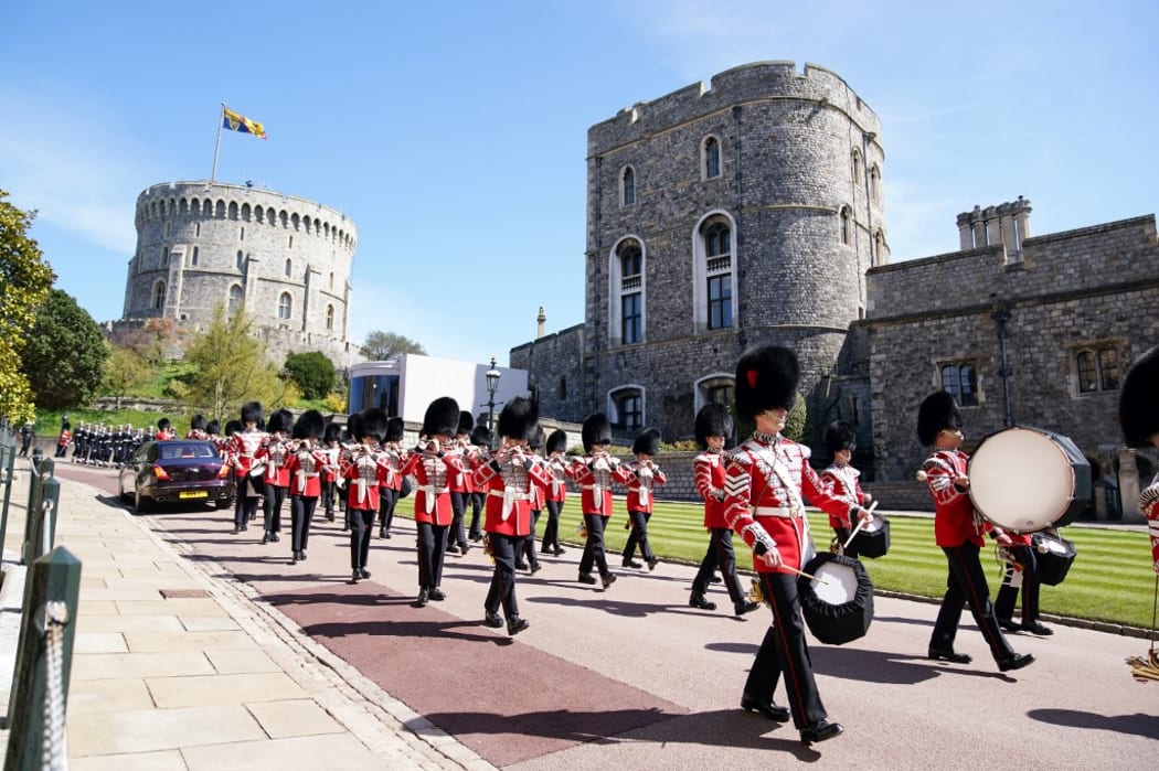 Members of the military march before the funeral service of Britain's Prince Philip, Duke of Edinburgh inside St George's Chapel in Windsor Castle in Windsor, west of London, on April 17, 2021.