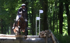 New Zealand's Clarke Johnstone with horse Menlo Park competes in the equestrian's eventing cross country during the Paris 2024 Olympic Games at the Chateau de Versailles, in Versailles, in the western outskirts of Paris, on July 28, 2024. (Photo by Pierre-Philippe MARCOU / AFP)