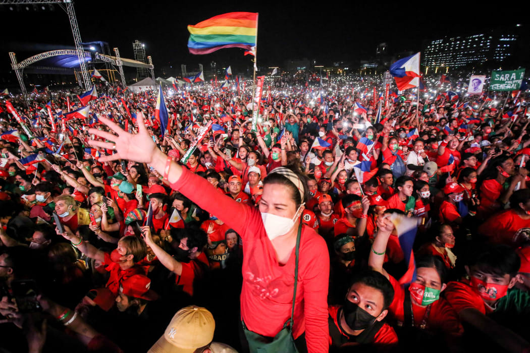 Supporters of Philippine presidential candidate Ferdinand Marcos Jr cheering during the last campaign rally ahead of the today's election.