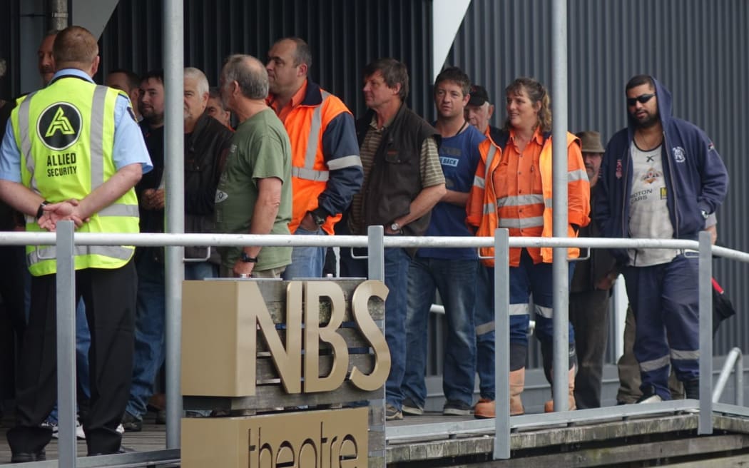 Workers attend today's meeting at the Stockton mine.