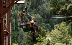 Protesters used the aerial ropeway cables as a zip line to access a coal bucket high off the ground.