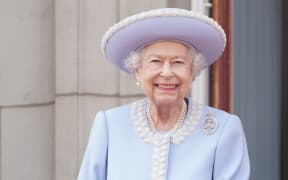 Britain's Queen Elizabeth II stands on the Balcony of Buckingham Palace bas the troops march past during the Queen's Birthday Parade, the Trooping the Colour, as part of Queen Elizabeth II's platinum jubilee celebrations, in London on June 2, 2022