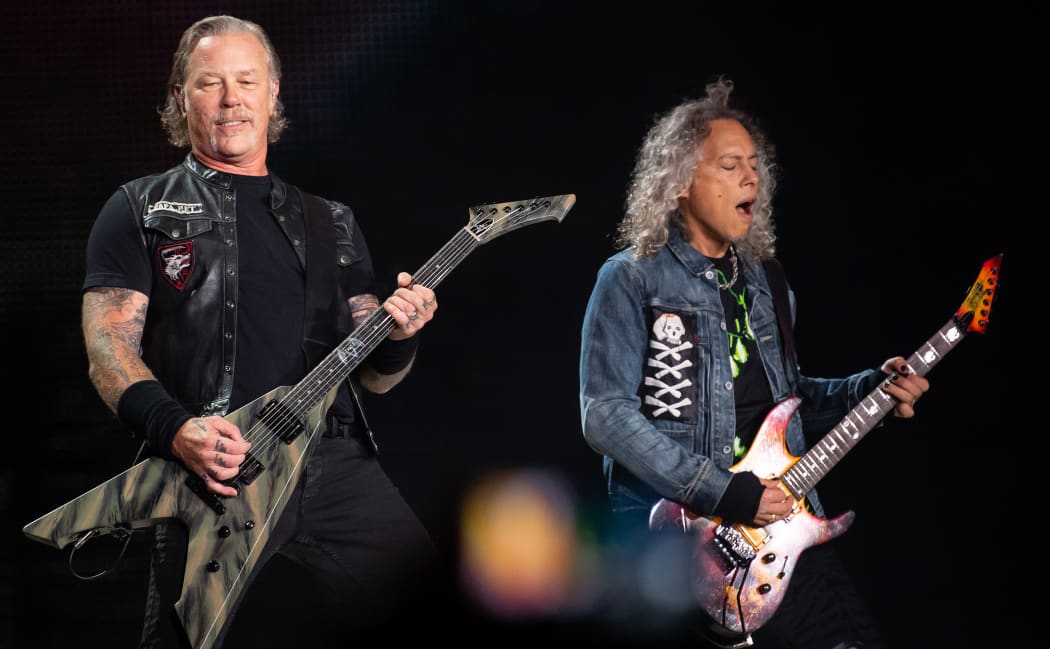 James Hetfield (L) and Kirk Hammett of Metallica perform on stage in Munich, southern Germany in 2019.