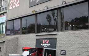 Bullet holes can be seen in the windows of Fight Club, a Head Hunters base.