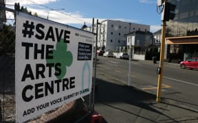 A 'Save the Arts Centre' banner hangs on the corner of the original Dux de Lux building site in central Christchurch.