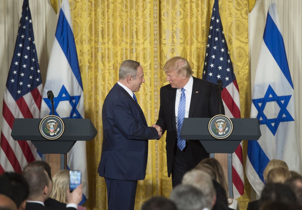 US President Donald Trump (R) and Israeli Prime Minister Benjamin Netanyahu hold a joint press conference in the East Room of the White House in Washington.
