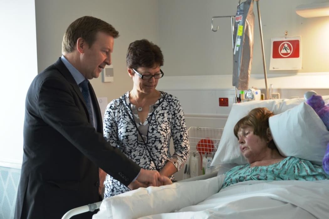 Jonathan Coleman at Wellington Hospital with a stroke patient.