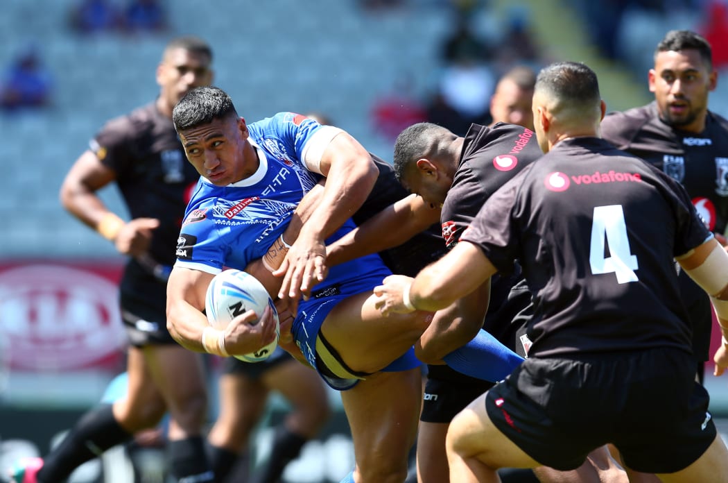 Marion Seve is dumped by Fiji defenders