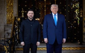 This handout photograph taken and released by the Ukrainian Presidential Press Service on December 28, 2025 shows US President Donald Trump (R) and Ukraine's President Volodymyr Zelensky (L) posing during their meeting for critical talks on ending the war with Russia at Trump's Mar-a-Lago estate in Palm Beach, Florida. (Photo by Handout / UKRAINIAN PRESIDENTIAL OFFICE / AFP) / RESTRICTED TO EDITORIAL USE - MANDATORY CREDIT "AFP PHOTO / UKRAINIAN PRESIDENTIAL OFFICE" - NO MARKETING NO ADVERTISING CAMPAIGNS - DISTRIBUTED AS A SERVICE TO CLIENTS