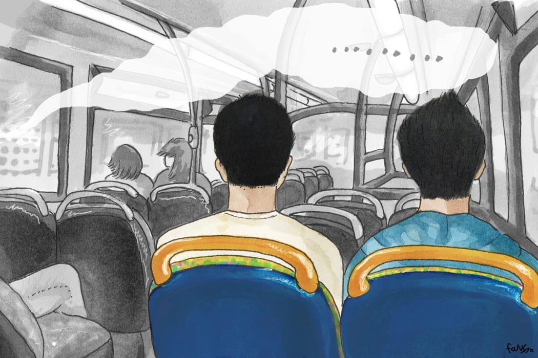 Two young men on a bus.