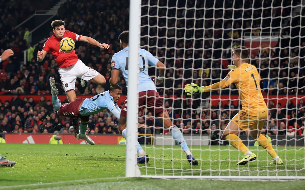 Harry Maguire of Man Utd fires in a header.