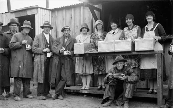 For people who lost their jobs and had few savings the early years of the 1930s were tough. Here a group of men queue with their enamel mugs for some hot soup.