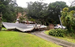 One of many houses on Domain Crescent in Muriwai destroyed by a slip