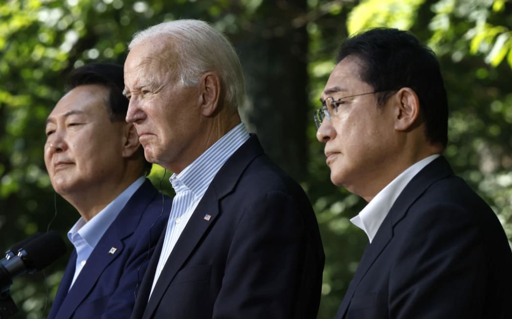 (L-R) South Korean President Yoon Suk Yeol, US President Joe Biden and Japanese Prime Minister Kishida Fumio hold a joint news conference following three-way talks at Camp David on August 18