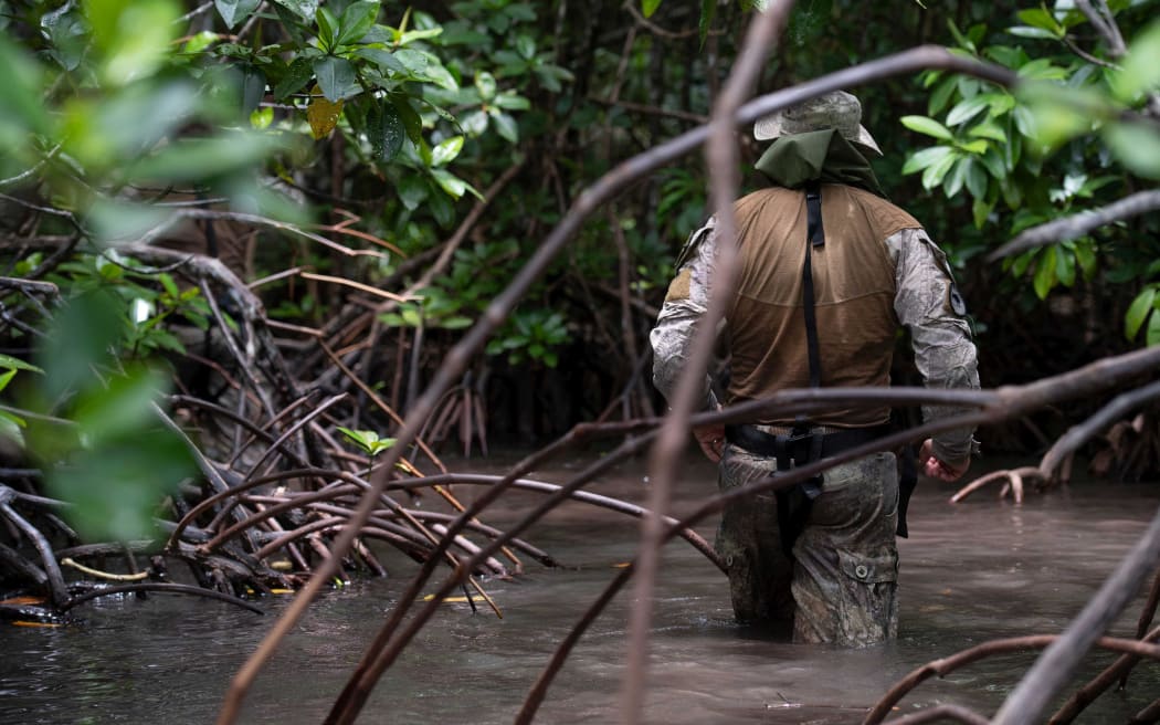 The RNZN dive team assist the Royal Solomon Islands Police Force by conducting unexploded ordinance clearance along the shores of the island of Kohingo.