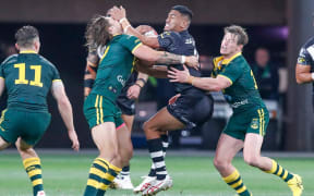 Ronaldo Mulitalo clashes with the Kangaroos defence during last weekend's defeat in Melbourne.