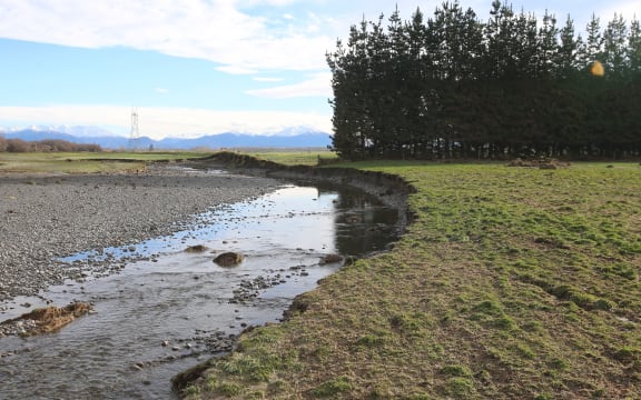 the Ashburton River is virtually running through the back of the Stewarts' family farm after May 2021 flooding